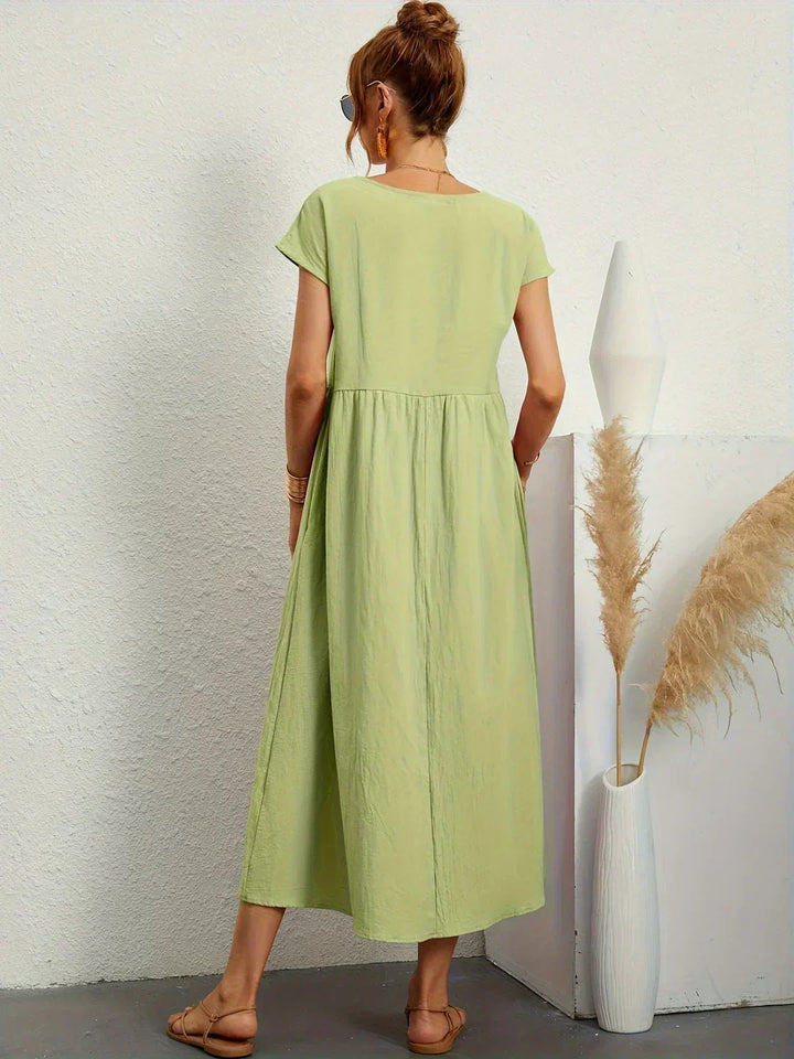 HEIKE | VLOEIEND MIDIKLEID VAN TIJDLOZE ELEGANTIE
